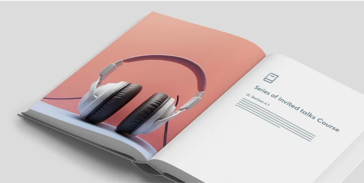 Headphones resting across an open book; left page shows a large photo of black-and-white headphones on a pink background, right page reads: "Series...