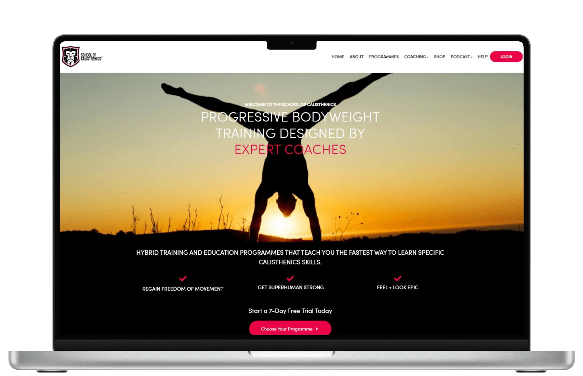 Silhouette of a person doing a handstand at sunset, displayed on a laptop screen showing a calisthenics website.