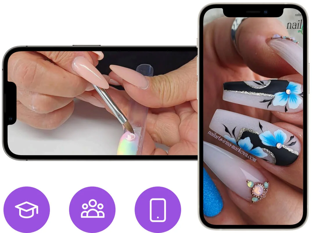 Manicurist's hands brush acrylic onto a nail tip while a second phone displays finished long coffin nails decorated with blue flowers, black accents,...