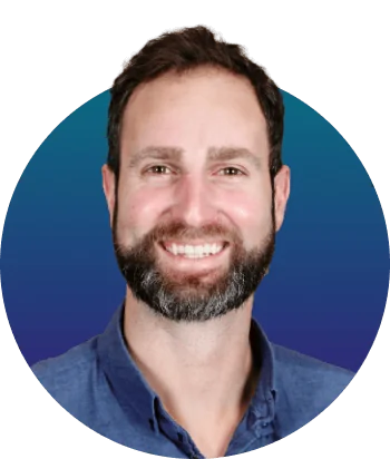 Bearded man smiling directly at camera, wearing a blue collared shirt against a circular teal-to-indigo gradient background.