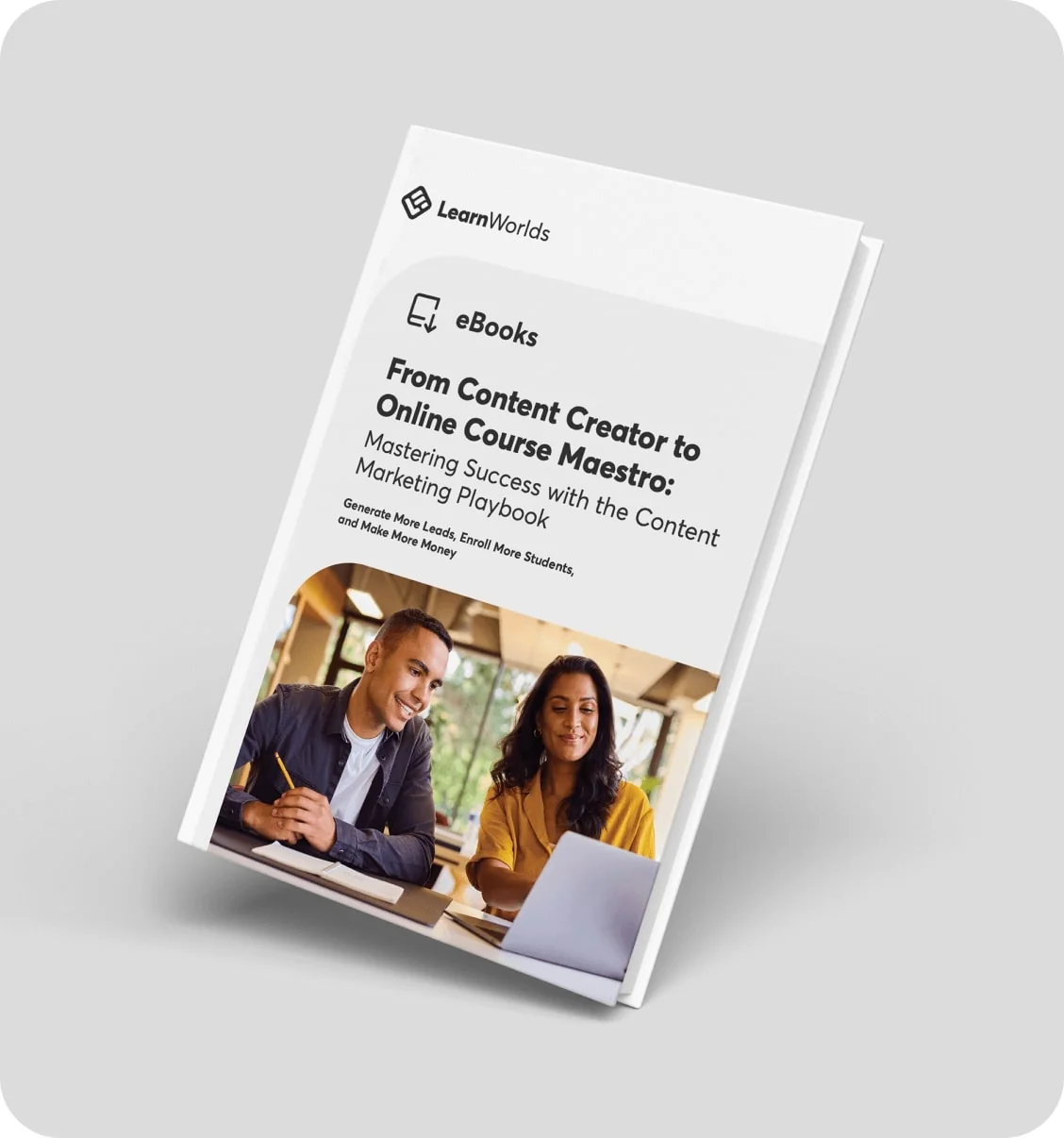 eBook cover displays a titled guide and a photo of two people collaborating over a laptop; angled white cover set against a light gray background.