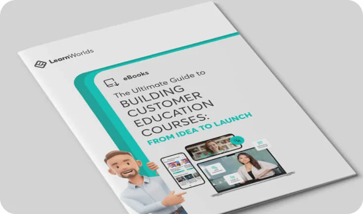 A softcover guide lies angled on a light gray surface, its white-and-teal cover showing a cartoon man pointing at device mockups and the book's title.