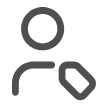 Simplified gray user silhouette with a small diagonal tag-like rectangle overlapping its right shoulder, set against a plain white background.