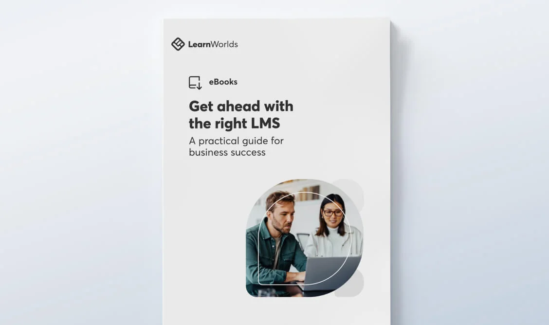 eBook cover (object) presenting an LMS guide (action) — two people work at a laptop within a circular photo on a pale gradient background (context).