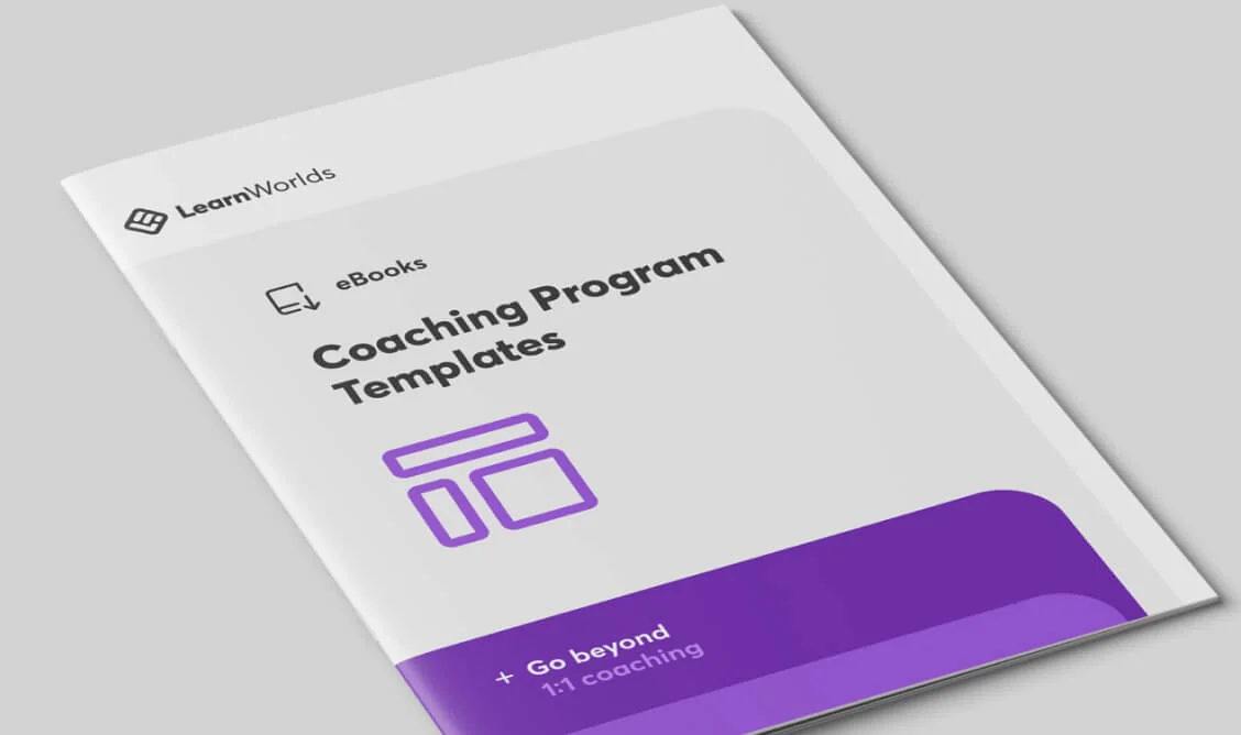Softcover booklet lies angled on a pale gray surface, showing cover text: "LearnWorlds", "eBooks", "Coaching Program Templates", "+ Go beyond 1:1...