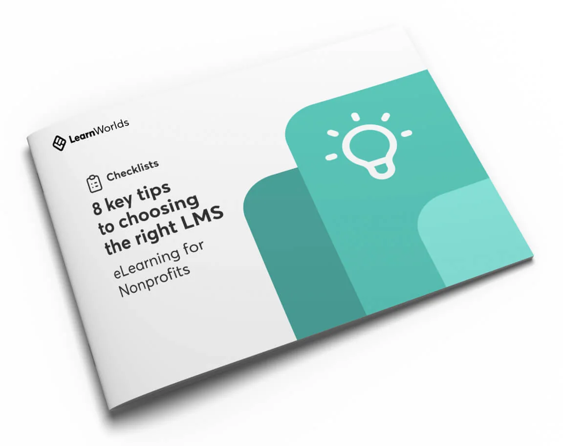 Stapled booklet lies angled on a white surface, showing a teal-themed cover with layered shapes and a lightbulb icon.
