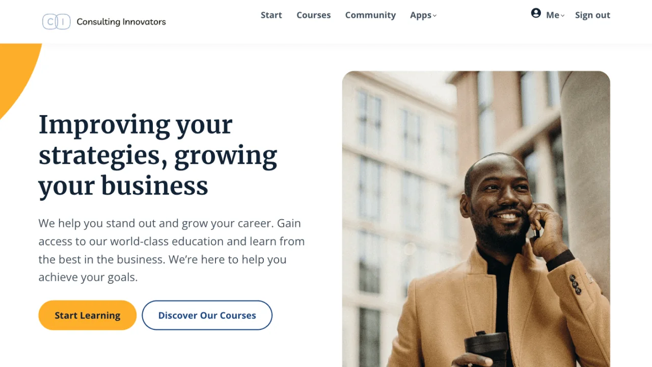 Man smiling while talking on a phone and holding a travel mug, shown in a website hero with a left column headline, paragraph, and two call-to-action...