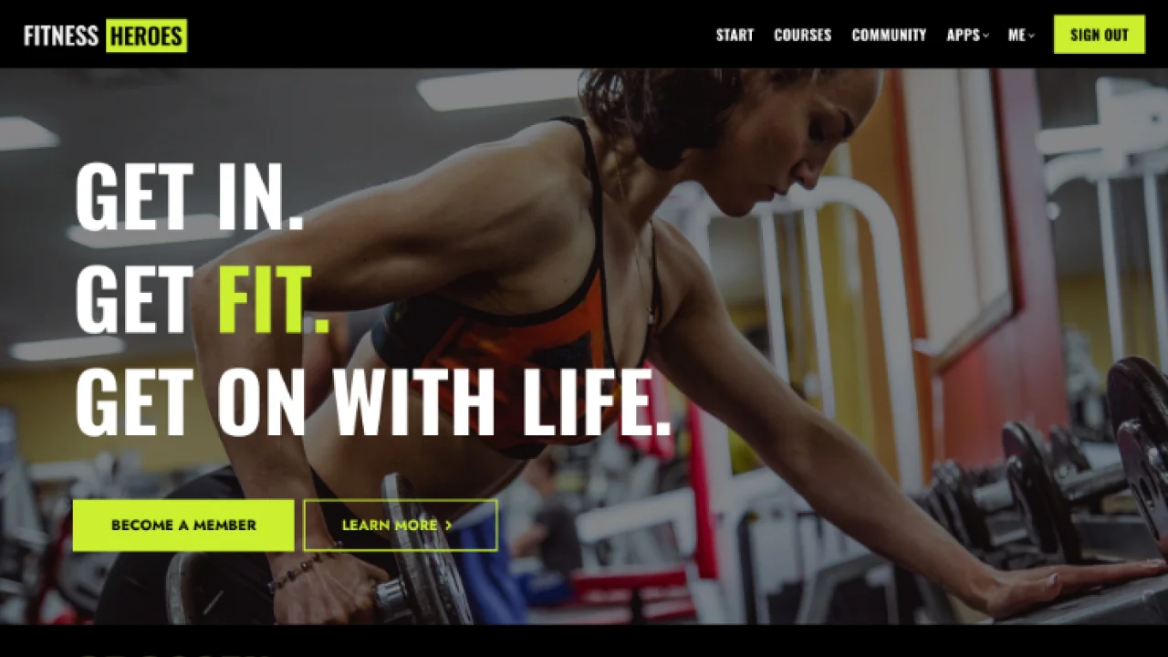 Woman performs a bent‑over dumbbell row in a gym, surrounded by weight racks and machines; a website hero overlay promotes joining and learning more.